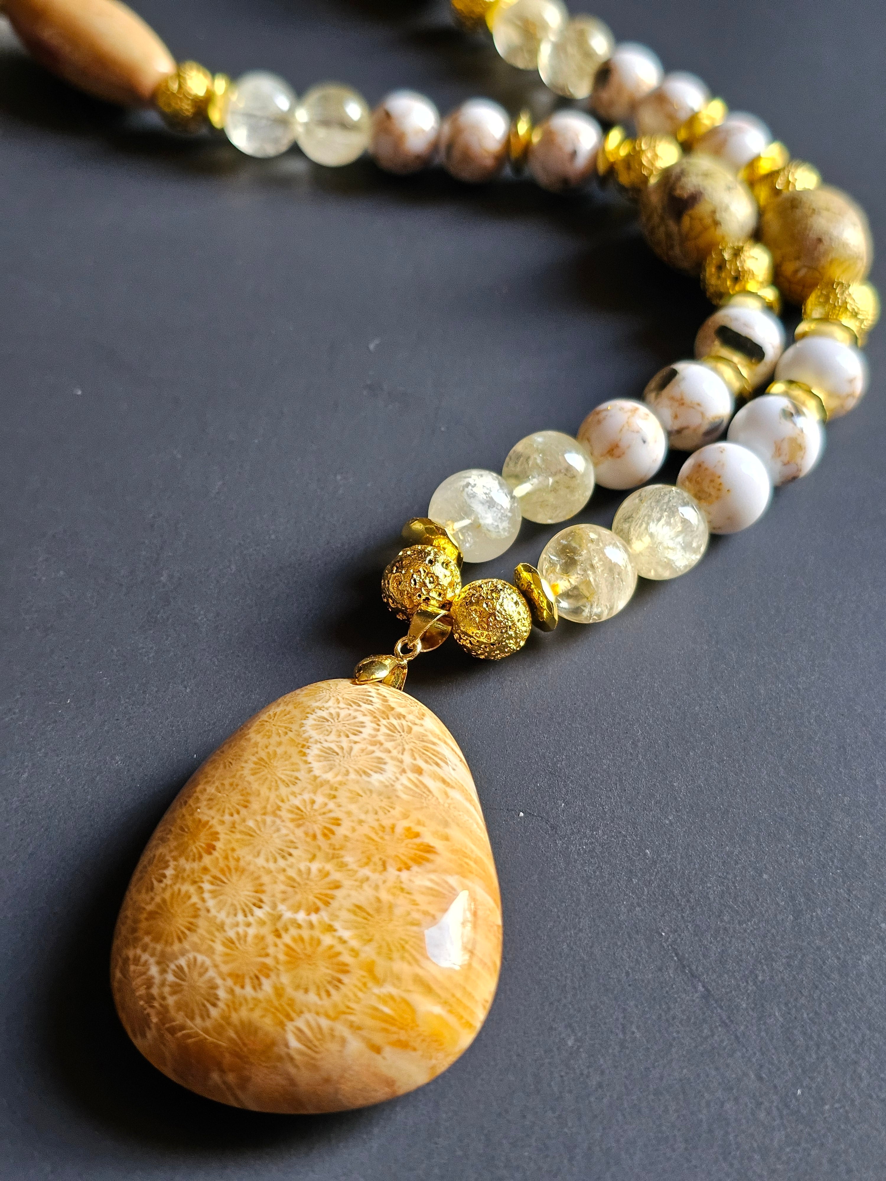 White Reconstructed Shell, Citrine, & Sunstone ft. Gold Lava Rock & Fossilized Coral Pendant