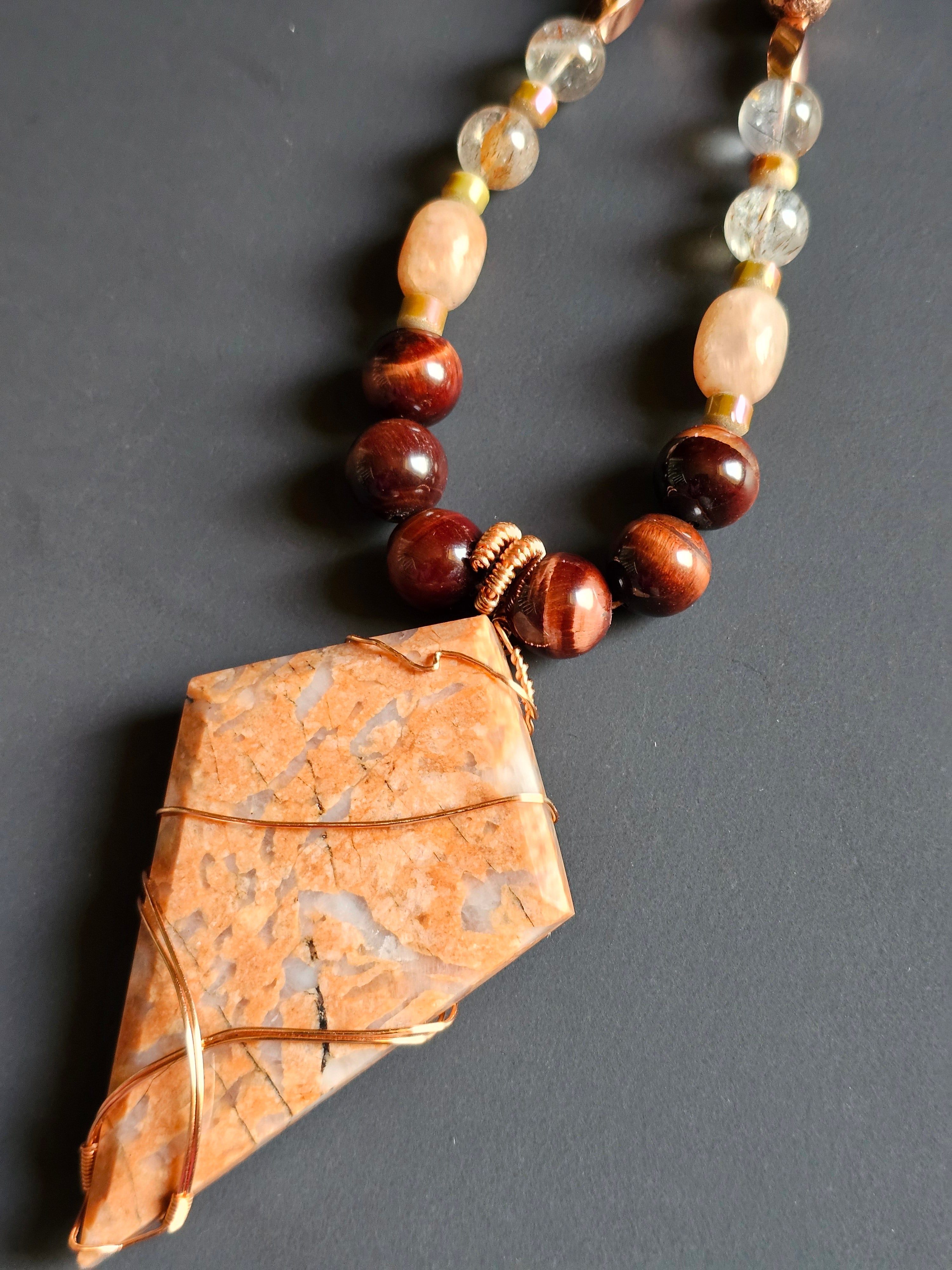 Red Tigers Eye, Sunstone, Red Rutilated Quartz, Rose Gold-toned Lava Rock ft. Flower Agate Pendant