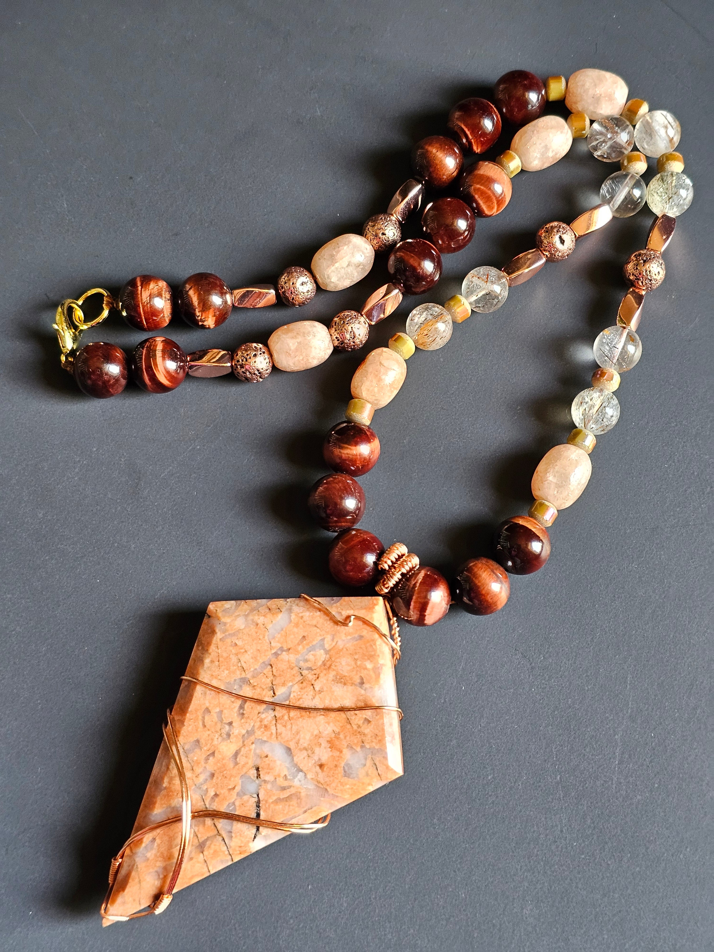 Red Tigers Eye, Sunstone, Red Rutilated Quartz, Rose Gold-toned Lava Rock ft. Flower Agate Pendant