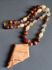 Red Tigers Eye, Sunstone, Red Rutilated Quartz, Rose Gold-toned Lava Rock ft. Flower Agate Pendant