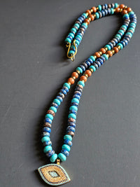 Rhyolite, Blue Howlite, Goldstone & Gold Hematite ft. Nazar Pendant